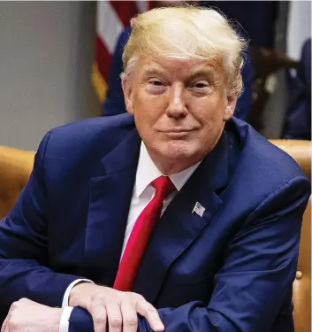  ?? AL DRaGO/BLOOMBERG ?? U.S. President Donald Trump smiles during a discussion in the White House. A recent survey found 25 per cent of Canadians expressed “confidence” in the U.S. president.