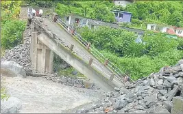  ?? HT PHOTO ?? A bridge that was damaged at Lakhi Ghigran village in Chamoli district due to heavy rains.