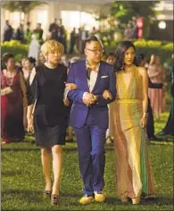  ?? Sanja Bucko Associated Press ?? THE FILM, shot in Malaysia and Singapore, features Awkwafina, from left, Nico Santos and Constance Wu.