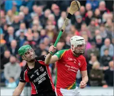  ??  ?? Liam Ryan of Rapparees wins this duel with county colleague Shaun Murphy (Oulart-The Ballagh).