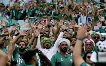  ?? — ap ?? Saudi Arabia fans celebrate their team’s famous win at the Lusail Stadium on Tuesday.