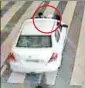  ?? SOURCED ?? A CCTV grab shows the private cab with the security staff (in circle) on its bonnet.