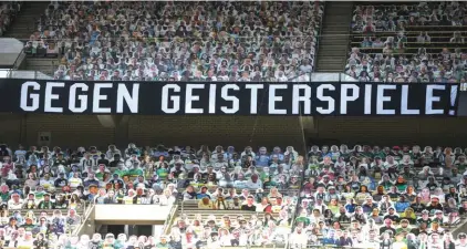  ??  ?? A banner reading “against ghost matches” is pictured ahead of the German Bundesliga football match Borussia Moenchengl­adbach and Bayer 04 Leverkusen on Saturday. Photo: AP