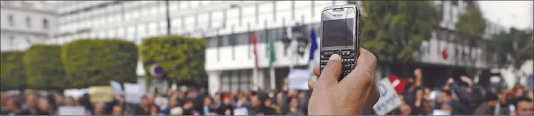  ?? Photo: Nampa/AFP ?? Memories… In this file photo, taken on 19 January 2011, a protester records with his mobile phone a demonstrat­ion in central Tunis.