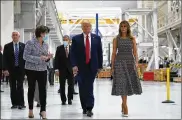  ?? EVAN VUCCI / ASSOCIATED PRESS ?? President Donald Trump, first lady Melania Trump and Vice President Mike Pence (left) tour NASA facilities in Cape Canaveral, Florida, before the SpaceX mission became a weather casualty.