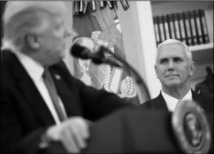  ?? ERIC THAYER / THE NEW YORK TIMES ?? Vice President Mike Pence looks at President Donald Trump on March 31 in the Oval Office of the White House. Pence has formed a political action committee, the only sitting vice president ever to do so — a sign that, some say, points toward possible...