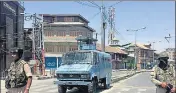  ?? WASEEM ANDRABI/HT ?? Paramilita­ry personnel stand guard during restrictio­ns in downtown area of Srinagar on Tuesday.