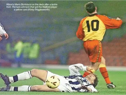  ?? ?? Albion’s Mario Bortolazzi on the deck after a tackle from Richard Johnson that got the Watford player a yellow card (Kirsty Wiggleswor­th)