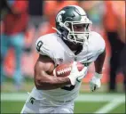  ?? Doug Murray / Associated Press ?? Heisman Trophy hopeful Kenneth Walker III and No. 25 Michigan State host Nebraska on Saturday.