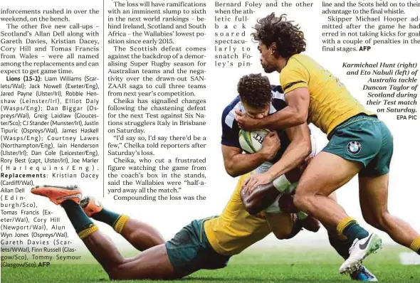  ?? EPA PIC ?? Karmichael Hunt (right) and Eto Nabuli (left) of
Australia tackle Duncan Taylor of Scotland during their Test match
on Saturday.