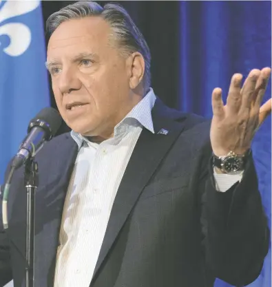  ?? JACQUES BOISSINOT / THE CANADIAN PRESS FILES ?? Quebec history has come full circle with Premier François Legault enacting paternalis­tic measures
of social engineerin­g and control like priests before the Quiet Revolution, says Terry L. Newman.