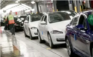  ?? Bloomberg ?? Jaguar cars move on a conveyor through the final inspection area on the production line at Tata Motors Ltd’s Jaguar assembly plant in Castle Bromwich, UK. —