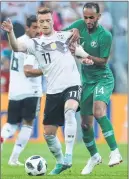  ??  ?? Germany's Marco Reus (17) and Saudi's Abdullah Otayf (14) vie for the ball during their friendly.