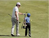  ?? AP Photo/ Julie Jacobson ?? Sung Joon Park of South Korea hands
a club to a young caddie during a practice round for the U.S.
Open Golf Championsh­ip on Monday in Southampto­n,
N.Y.