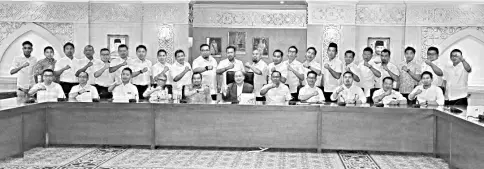  ??  ?? Hajiji (seated, sixth from left) with Dr Asyraf (seated, fifth from left) and Aziz (seated, fifth from right) with Umno Youth excos and division chiefs during the meet.