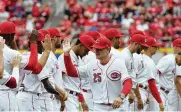  ?? JABLONSKI / STAFF DAVID ?? Reds manager David Bell (25) has numerous roster questions facing him as spring training opens such as figuring out the back part of the starting rotation and settling on who plays shortstop and third base.