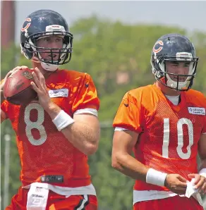  ?? JOHN KRYK / POSTMEDIA NEWS ?? Mike Glennon, left, has rendered No. 2 overall pick Mitchell Trubisky to an understudy role with his early poise at the Chicago Bears training camp.