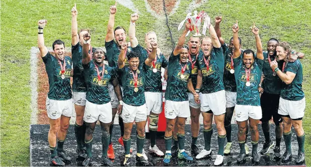  ?? Picture: AFP ?? The Blitzboks pose with the trophy from the World Sevens Series in Paris last week. Now another world title beckons in the sevens World Cup in San Diego next month.