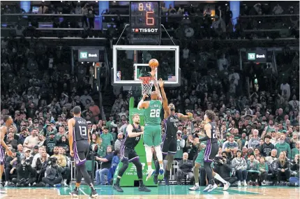  ?? ?? IN THE NICK OF TIME: Xavier Tillman of the Boston Celtics puts up the winning shot over Harrison Barnes of the Sacramento Kings late in the fourth quarter of their 101-100 win at TD Garden in Boston.