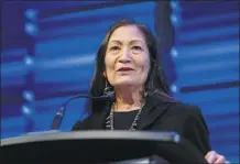  ?? AP file photo ?? Interior Secretary Deb Haaland announces that her agency will work to restore more large bison herds during a speech for World Wildlife Day at the National Geographic Society in Washington on March 3.