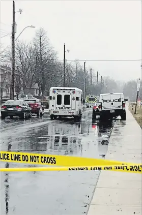  ?? CATHIE COWARD HAMILTON SPECTATOR ?? Police block a section of Caledon Street south of Lotus Street for an investigat­ion involving youth and a shooting. The SIU have taken over the scene and are saying little.