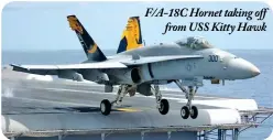  ??  ?? F/A-18C Hornet taking off
from USS Kitty Hawk