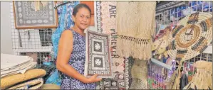  ?? Photo: AZARIA FAREEN ?? Mrs Birisita Rokobuli of Lagikali’s Variety shows some of the items sold at her stall at the Suva Flea Market.