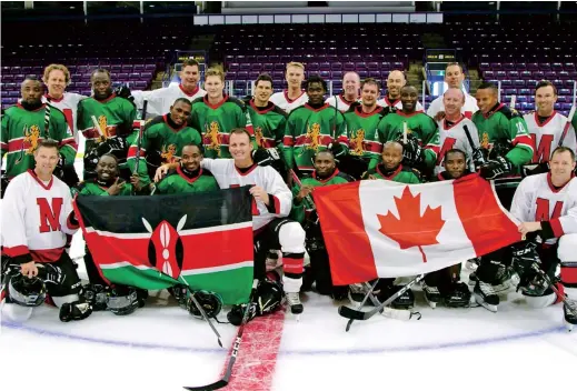  ??  ?? Ice Lions, Kenya’s only ice hockey team, wear green uniforms and pose for a team photo following their debut game against a recreation­al team made up of firefighte­rs in Toronto, Ontario, Canada. — Reuters