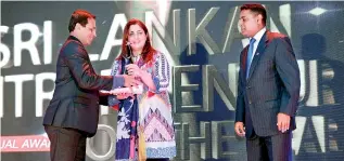  ??  ?? Dhanusha Group of Companies official accepts the award