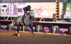  ?? Rob Carr / Getty Images ?? Jockey Joel Rosario rides Knicks Go to win the Breeders’ Cup Classic on Saturday in Del Mar, Calif.