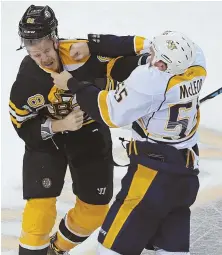  ?? STAFF PHOTO BY JOHN WILCOX ?? TOE-TO-TOE: Kevan Miller battles Nashville’s Cody McLeod during the Bruins’ 4-1 win last night at the Garden.