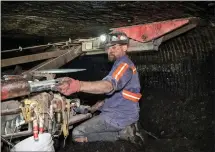  ??  ?? A coal worker at a mine in Virginia