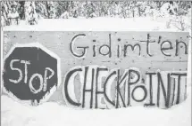  ?? CP PHOTO ?? A sign for a blockade check point by the Gidimt’en clan of the Wet’suwet’en First Nation is shown in this undated handout photo posted on the Wet’suwet’en Access Point on Gidumt’en Territory Facebook page.