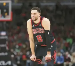  ?? BRIAN CASSELLA/CHICAGO TRIBUNE ?? Chicago Bulls guard Zach LaVine smiles during the first half of a game April 6 at the United Center.