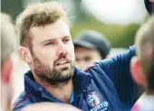  ??  ?? Bunyip coach Curtis Jenkin addresses the reserves team at quarter time.