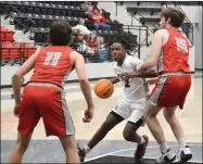  ?? ?? Sophomore Blackhawk Zion Whitmore, No. 2, worked past defenders towards the basket Saturday in the Battle on the Ridge.