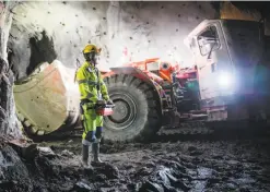  ??  ?? Oskar Pals, 19, operates a loader by remote control at the mine.