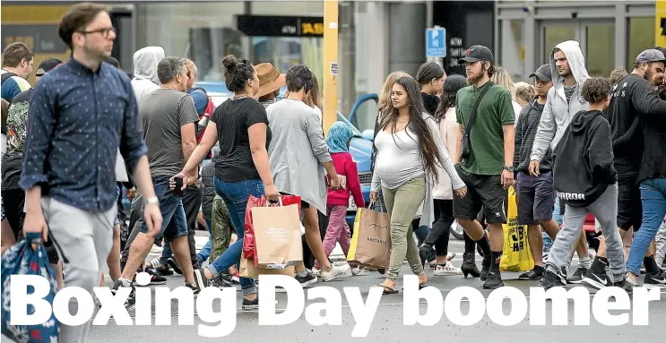  ?? MURRAY WILSON/STUFF ?? Shoppers pour in and out of The Plaza in Palmerston North during yesterday’s Boxing Day sales.