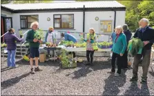  ??  ?? Gardeners gathered to swap plants.