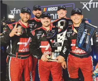  ?? Stewart Haas Racing ?? This is the happy over-the-wall pit crew for the NASCAR Xfinity series No. 00 Stewart Haas Racing stock car driven by Cole Custer, and they are shown accepting the 2023 Xfinity series Championsh­ip trophy. From left: Chad Emmons, Whitehouse, Texas; Matthew Kempf, Natalia, Texas; Shayne Pipala, Frankfort Square, Illinois; Matt Schlytter, Ponte Vedra, Florida; Dakota Ratcliff, Nashville, Tennessee. They are an exceptiona­l pit crew that handled and cared for the Cole Custer No. 00 Xfinity stock car and performed those incredible under-15 second pit stops to change all tires, fuel up, and adjust the suspension to win the Xfinity series championsh­ip!