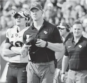  ?? TOMMY GILLIGAN/USA TODAY SPORTS ?? UCF coach Scott Frost has been training to be a head coach since his NFL playing days.