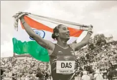  ?? AP ?? ■ Hima Das celebrates after her victory in women's 400 metres race at the 2018 IAAF World U20 Championsh­ips in Tampere, Finland, July 12