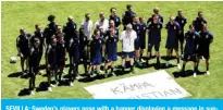  ??  ?? SEVILLA: Sweden’s players pose with a banner displaying a message in support of Denmark’s midfielder Christian Eriksen prior to an MD-1 training session at La Cartuja Stadium yesterday on the eve of their UEFA EURO 2020 Group E football match against Spain. — AFP