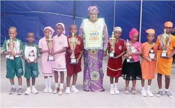  ?? ?? Pastor Joy Muoka with pupils of Chosen Internatio­nal Schools during their inter- house sports competitio­n recently
