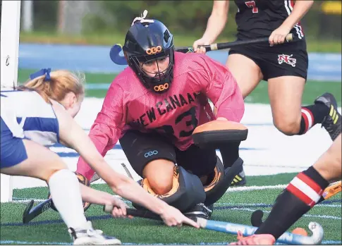  ?? Dave Stewart / Hearst Connecticu­t Media ?? New Canaan goalie Grace Gilman dives out to play the ball during the Rams’ game in Darien on Oct. 22.