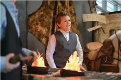  ?? Staff photo by Hunt Mercier ?? ■ Fifth-grade students at St. James Day School talk about their colonial blacksmith workshop and the history behind their characters Friday during the Colonial Fair in Texarkana, Texas.