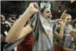  ??  ?? CHRIS SZAGOLA —THE ASSOCIATED PRESS Princeton’s Bella Alarie reacts with her new T-shirt as she celebrates after an NCAA college basketball championsh­ip game against Pennsylvan­ia in the Ivy League Tournament on Sunday.