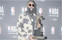  ?? — USA TODAY Sports photo ?? Harden poses for photos with his MVP award during the NBA Award Show at Barker Hanger.