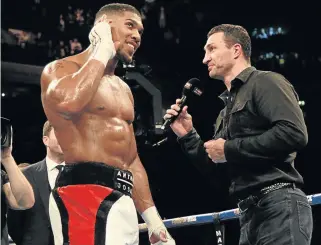  ?? Picture: EPA ?? IT’S LOUD AND CLEAR:Ukrainian boxer Wladimir Klitschko, right, enters the ring to confirm his fight with British boxer Anthony Joshua. The Klitschko fight is due to take place at Wembley stadium, London, early next year