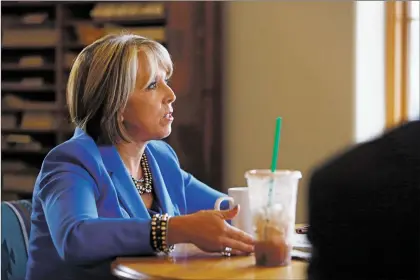  ?? Luis Sánchez Saturno/New Mexican file photo ?? Gubernator­ial candidate Michelle Lujan Grisham speaks with the staff of The New Mexican on Oct. 8.